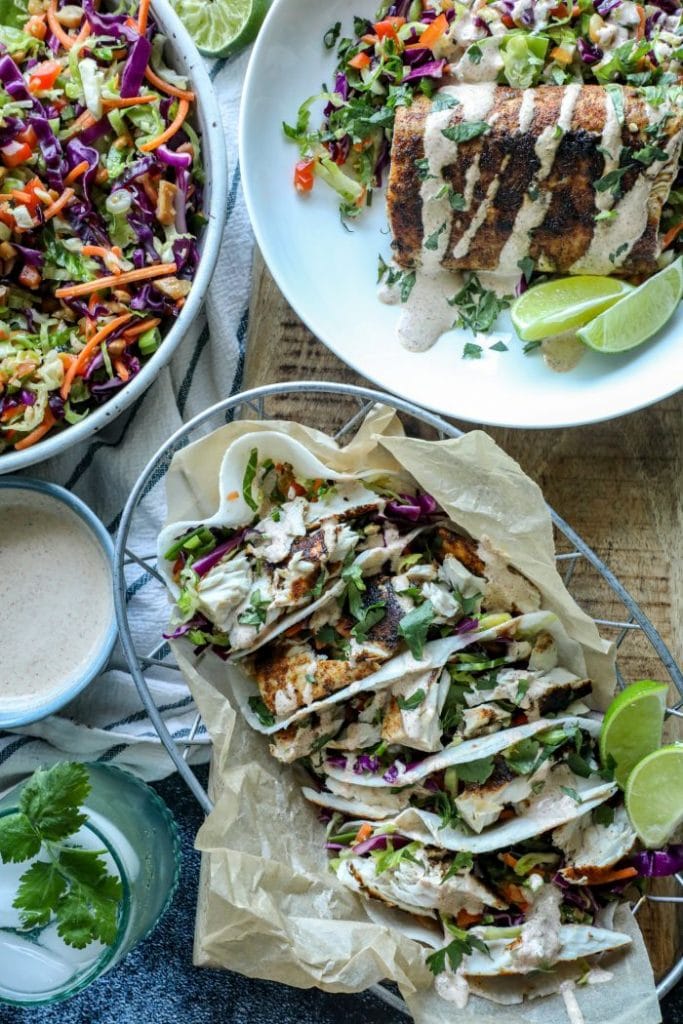 Easy Blackened Mahi Mahi Fish Taco Bowls and tacos on a table family style.