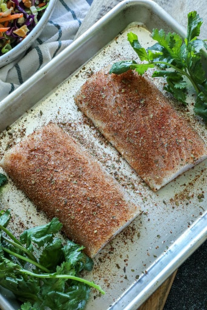 Raw mahi mahi coated in the Cajun dry rub blackened seasoning mix.