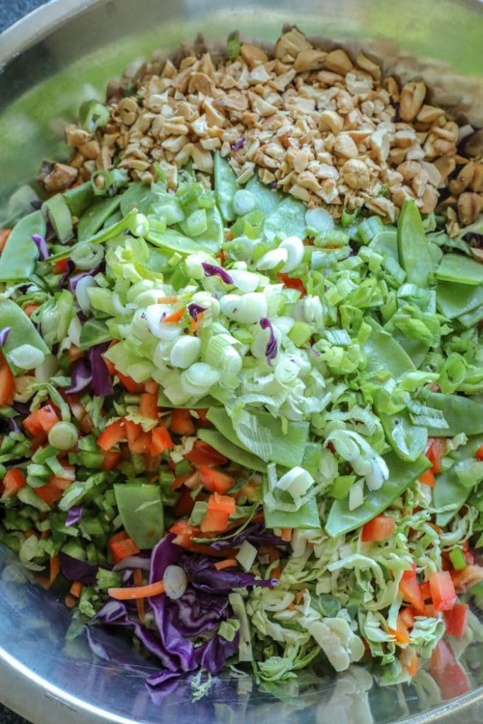 Easy Brussel Sprout Fish Taco Slaw  vegetables diced up and added to a bowl. 