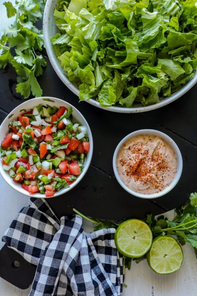 Grilled Chili Lime Chicken Fajita Salad toppings and lettuce. 