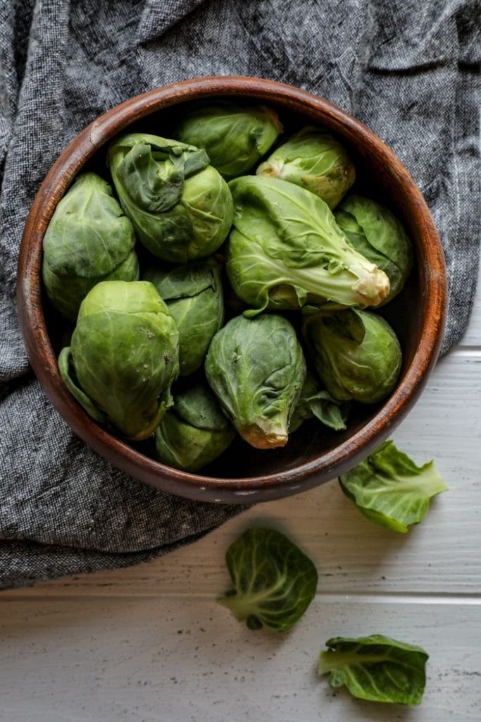 A bowl of whole brussels sprouts.