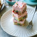 4 stacked cookie bars on a white plate