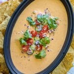 Smoked queso on the big green egg in a dish with chips