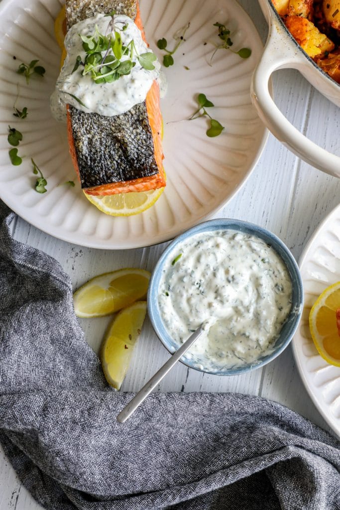 Salmon served with lemon dill sauce