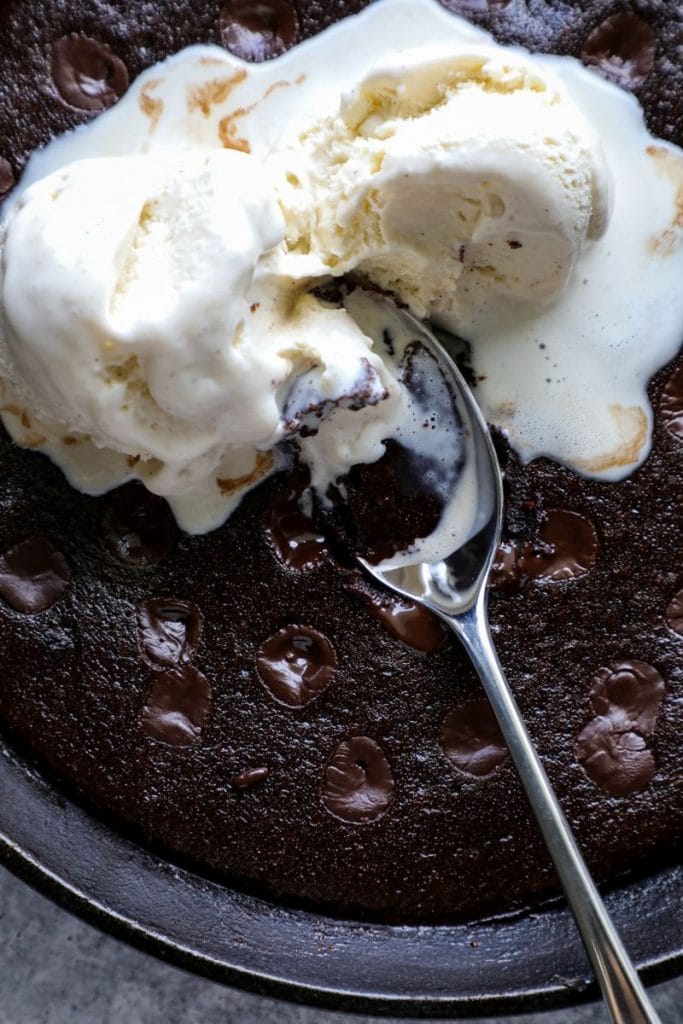 Fudgy Keto Skillet Brownies with ice cream on top