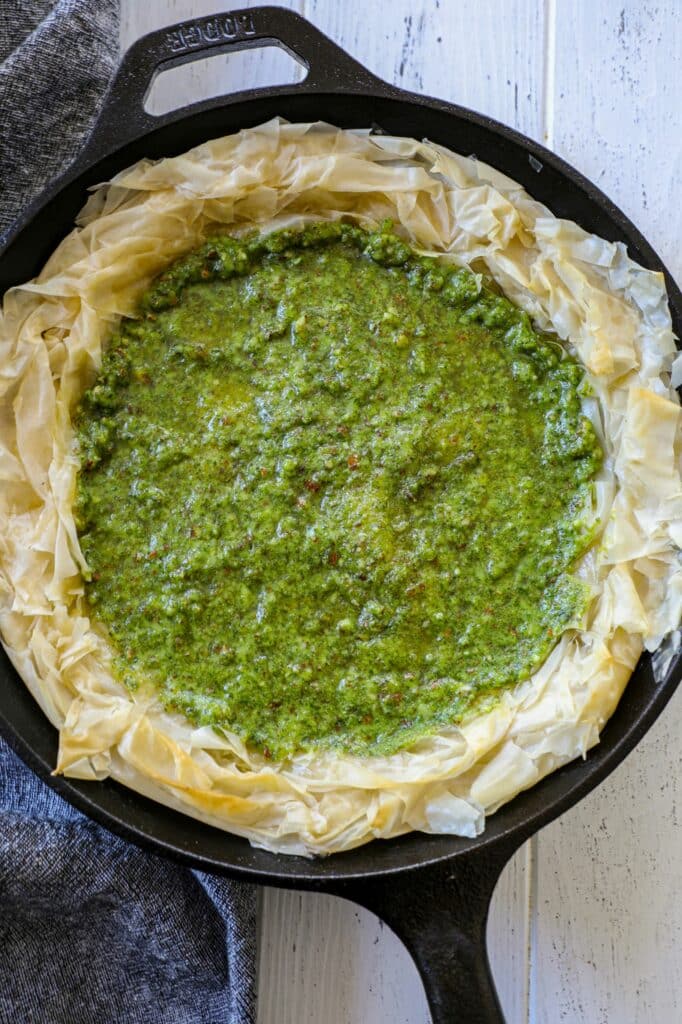 Tomato Pesto Phyllo Tart- showing the pesto layer in the crust 