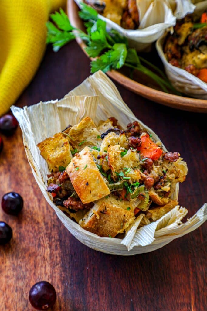 Sausage Stuffing Muffin in a corn husk on a wooden background.