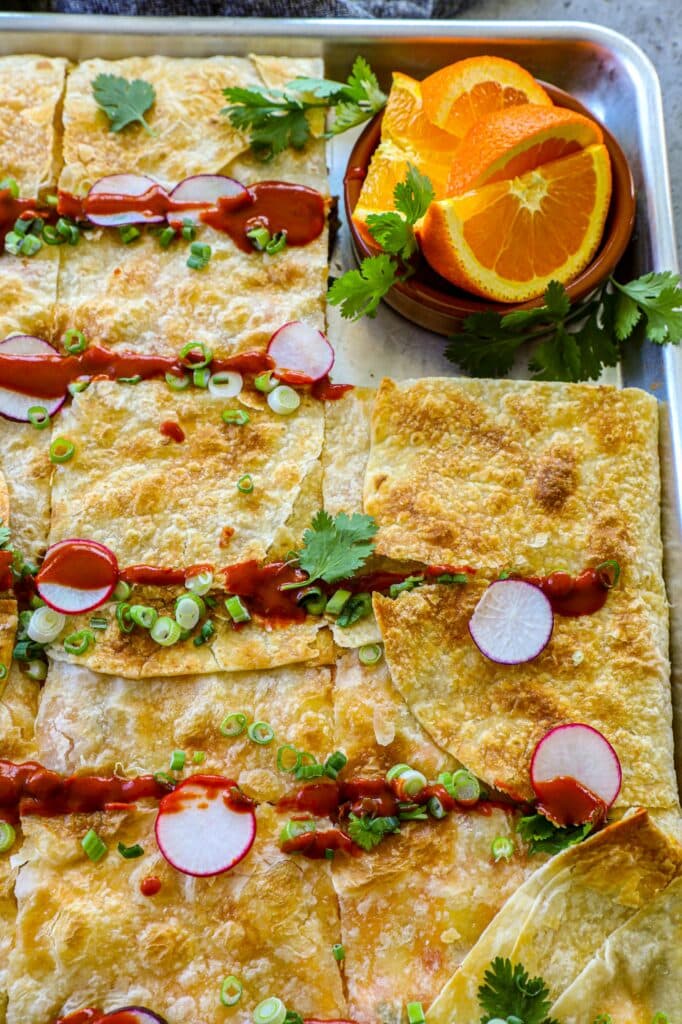 Sheet Pan Breakfast Burritos in a sheet pan after being sliced. 