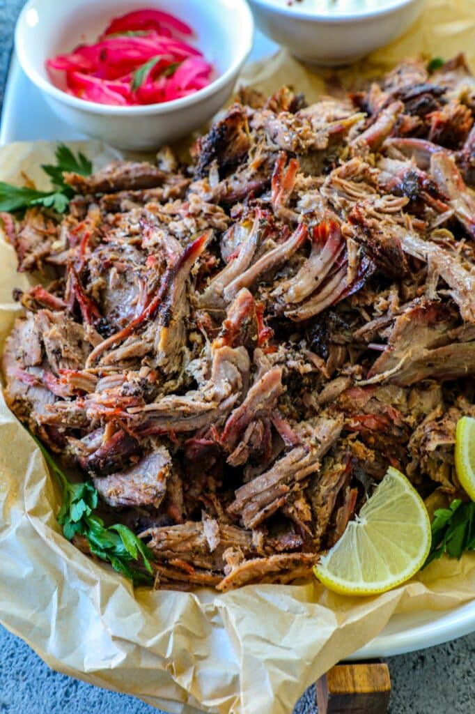 Smoked Leg Of Lamb (Pulled Lamb) on a serving platter. 