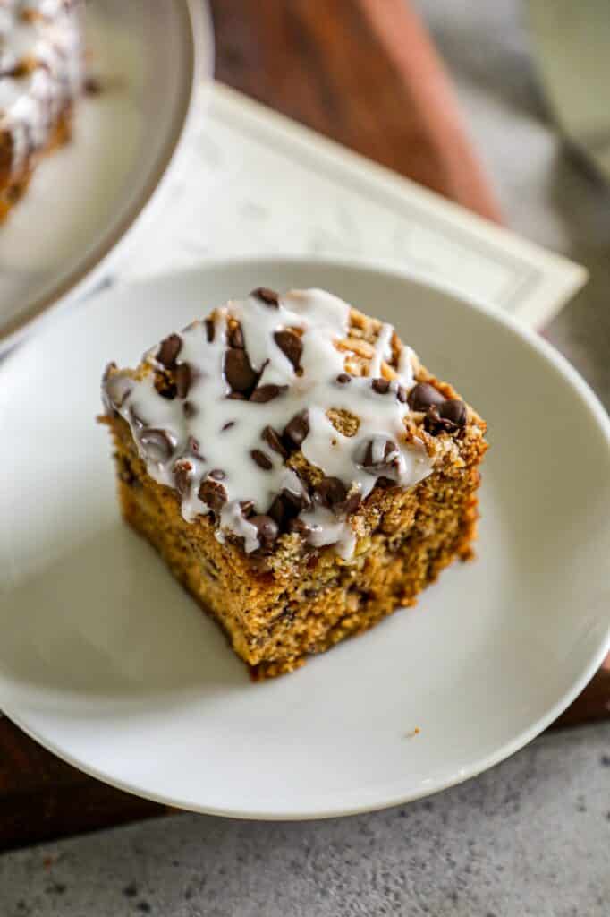 Slice of Banana Coffee Cake served on a white plate. 