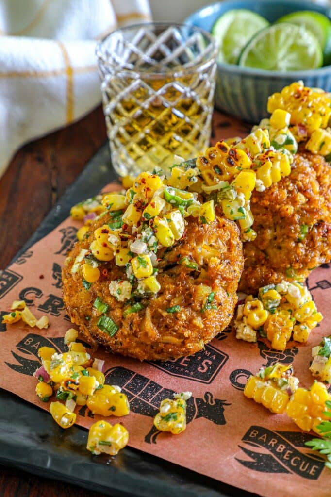 Smoked Crab Cakes Recipe served with grilled esquites on top. 