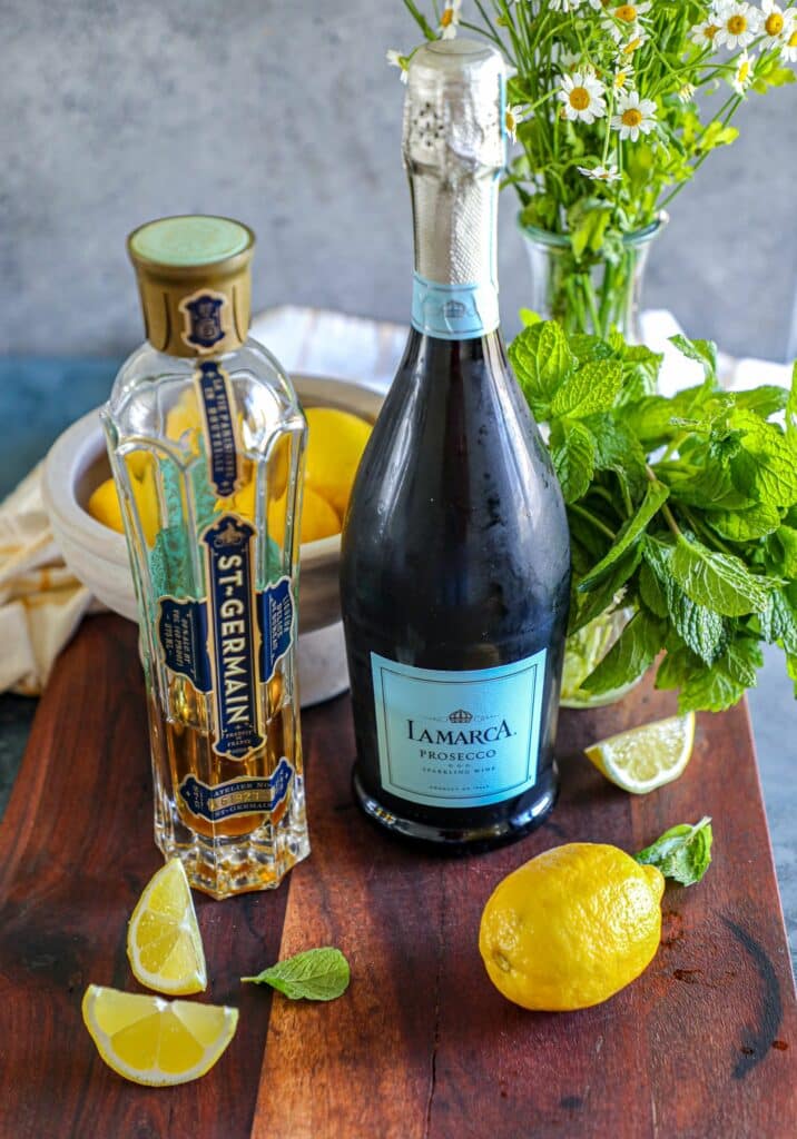 Hugo Spritz Recipe ingredients (Prosecco, St Germain elderflower liqueur, lemon, mint)  